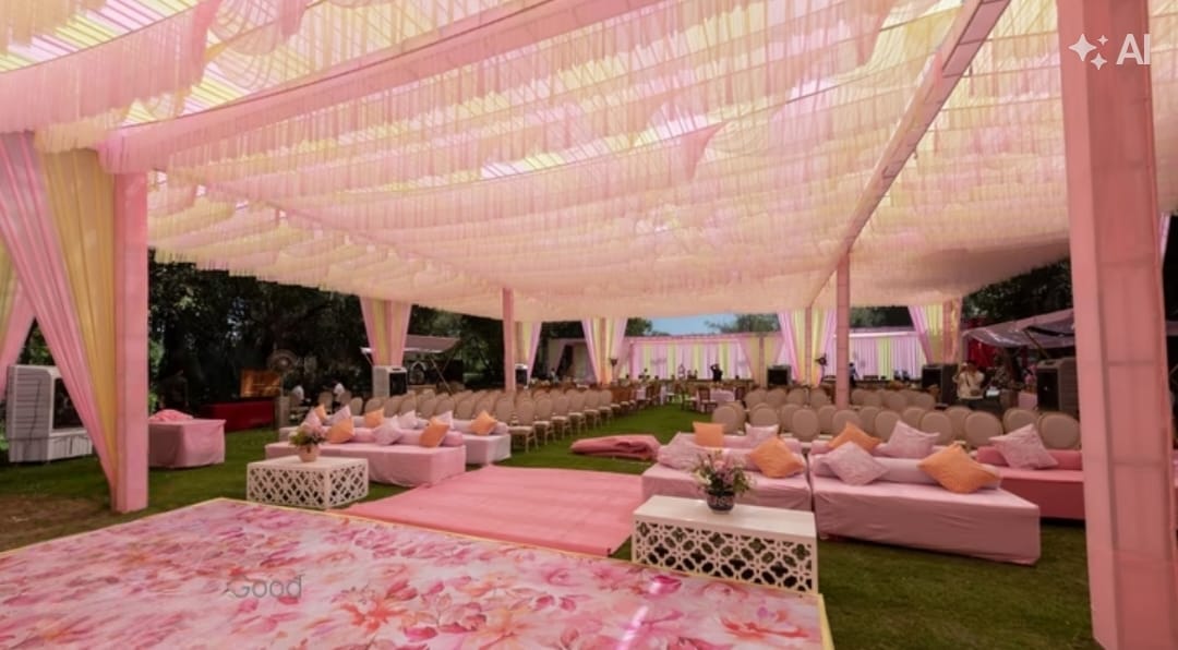 Evening wedding ceremony aisle at The Heaven Garden Lawns with floral mandap and fairy lights