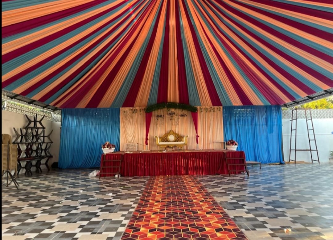 Covered hall with decorated stage at The Heaven Garden Lawns
